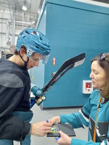 Heather meeting sports hockey player and getting his autograph