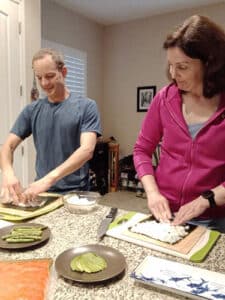 Randell and Heather at home preparing a meal together