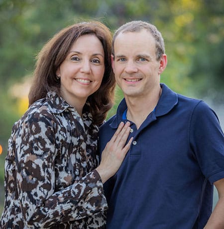 Randell and Heather outside, excited for adoption of their first child